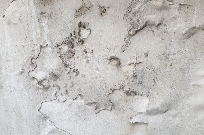 Bubbling of Plaster on a Wall Due to Dampness
